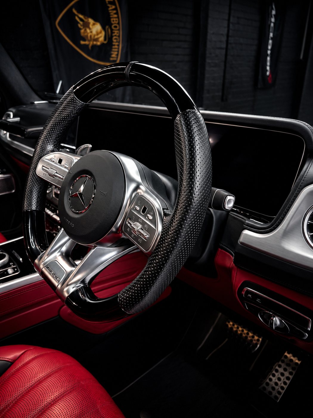 Mercedes-AMG interior — carbon and perforated leather steering wheel over red leather